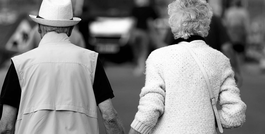 a senior couple walking side by side