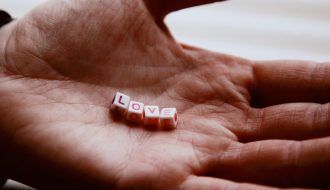 hands carrying love letter
