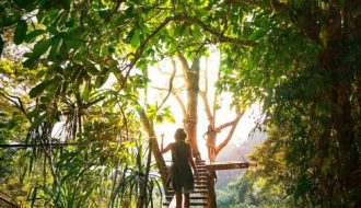 a girl walking on a bridge path