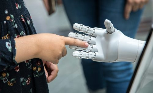 https://unsplash.com/photos/a-person-holding-a-robotic-hand-in-front-of-a-mirror-_7ceGXTAtyQ?utm_content=creditShareLink&utm_medium=referral&utm_source=unsplash