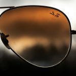 https://unsplash.com/photos/a-pair-of-sunglasses-with-a-reflection-of-a-cloudy-sky-5eqjmNigQoA?utm_content=creditShareLink&utm_medium=referral&utm_source=unsplash
