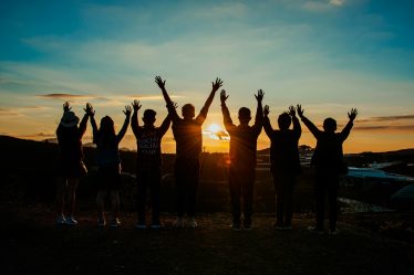 a group of happy people meditation affirmation rich cancer free