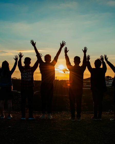 a group of happy people meditation affirmation rich cancer free